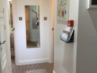 Flat entrance (bathrooms on each side)